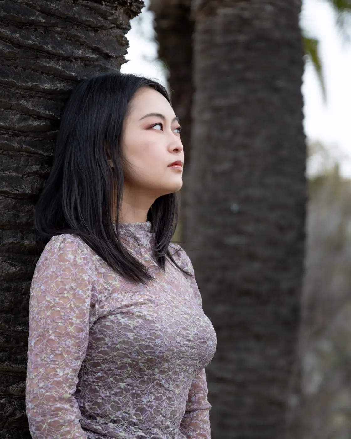 Portrait by palm tree